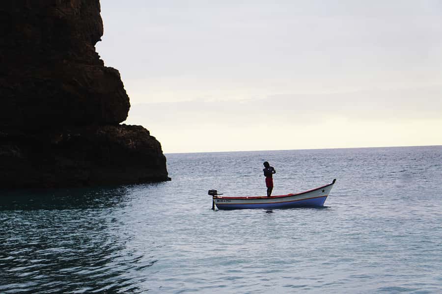 From Praia: Boat Trip, Snorkeling, Cave & BBQ on the Beach - A fish barbecue on the black-sand beach